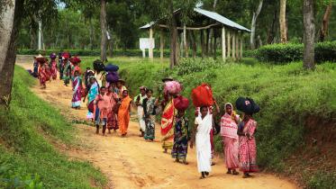 1.-women-tea-worker-return-home-after-days-hard-work.photo_.jpg