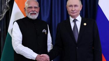 ভারতের মোদি ও রাশিয়ার ট্রাম্প। ফাইল ছবি: এএফপি